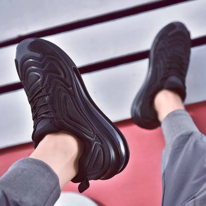 Men's black casual air cushion sneakers with a thick sole and round toe design.