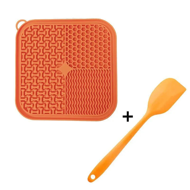 Square orange and blue silicone dog licking mat with textured surface and suction cups on the back.