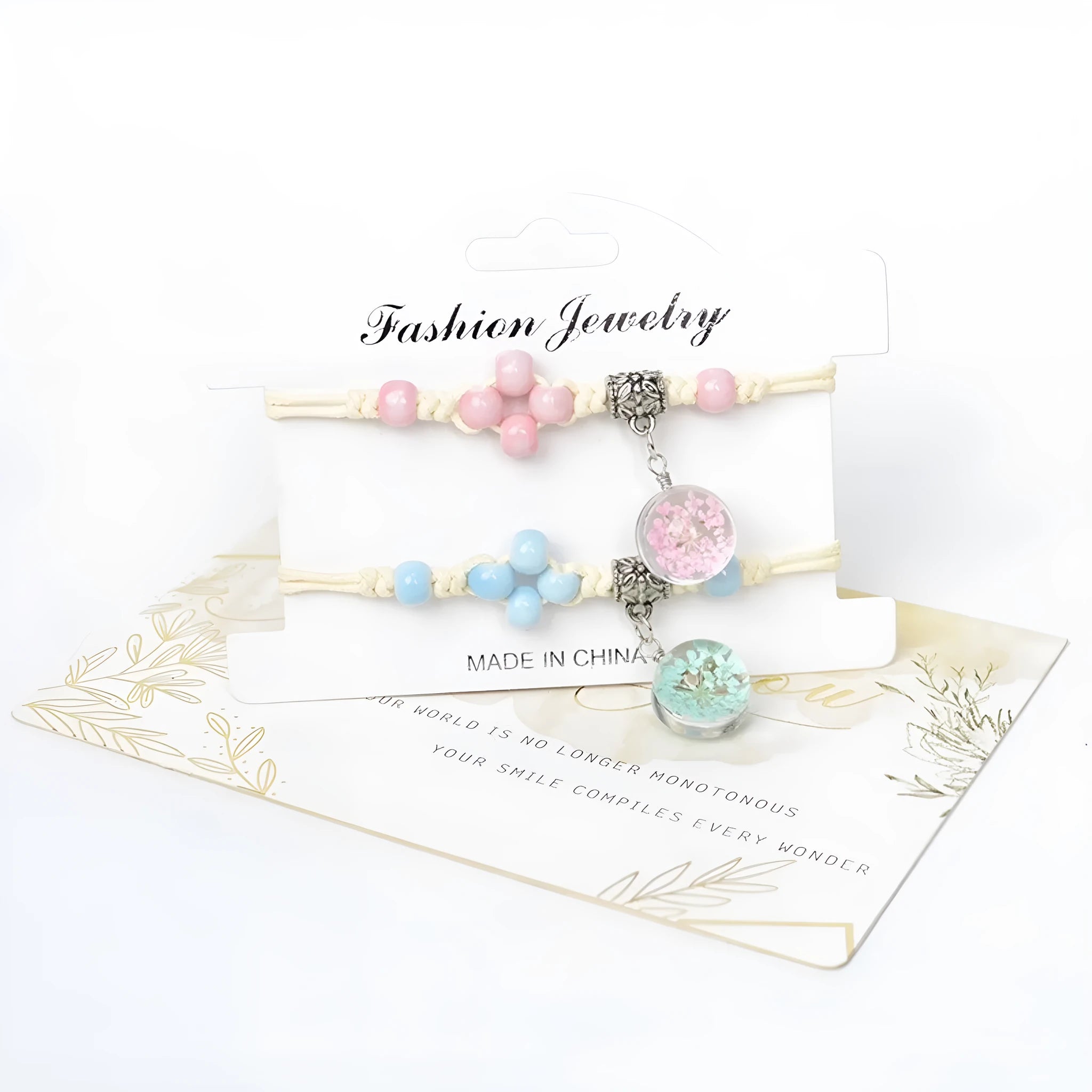 Close-up of a hand-woven glass bracelet with large beads containing real dried flowers and a lace design.