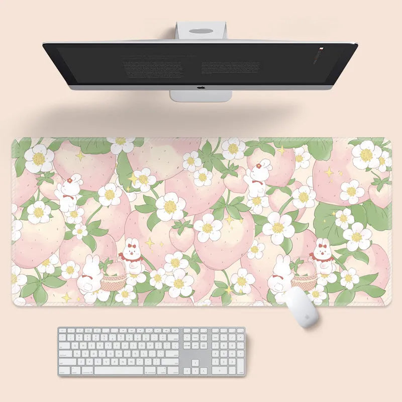 Large floral pattern mouse pad on a desk with keyboard and mouse, showing non-slip rubber base.