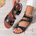 Women's flat sandals with adjustable Velcro straps in black, brown, or colourful designs