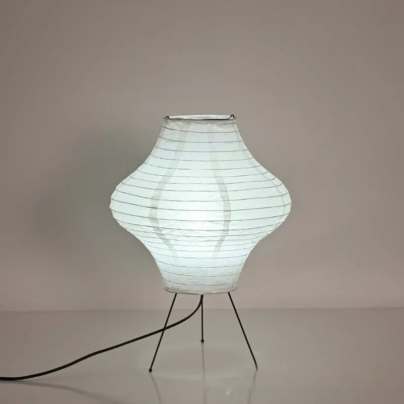 Japanese style decorative table lamp with a white Xuan paper shade on a wooden base.