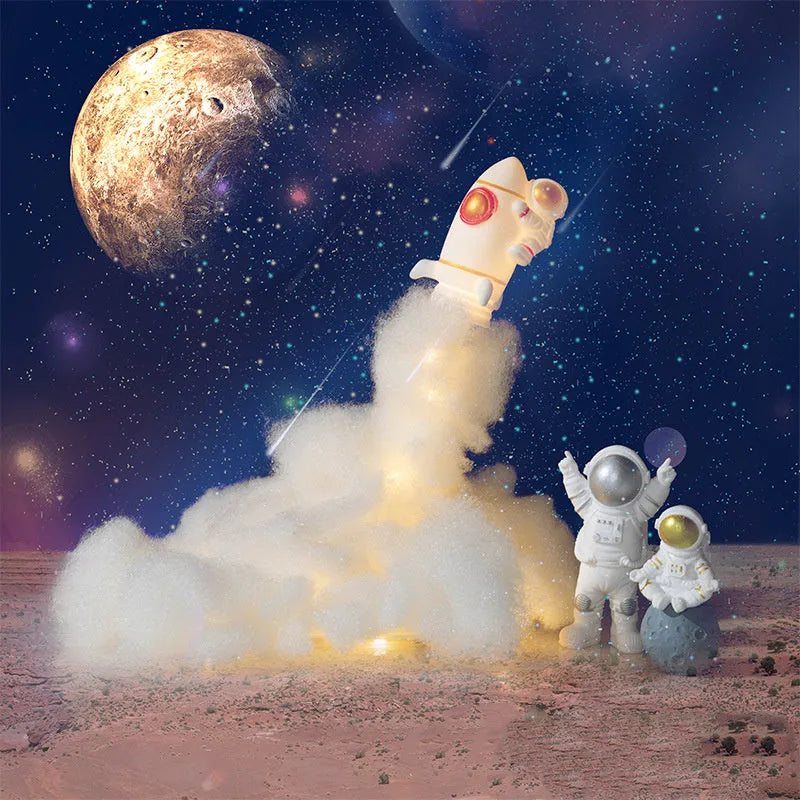 DIY astronaut rocket night light kit components including rocket model, LED string lights, straws, and chassis for assembly