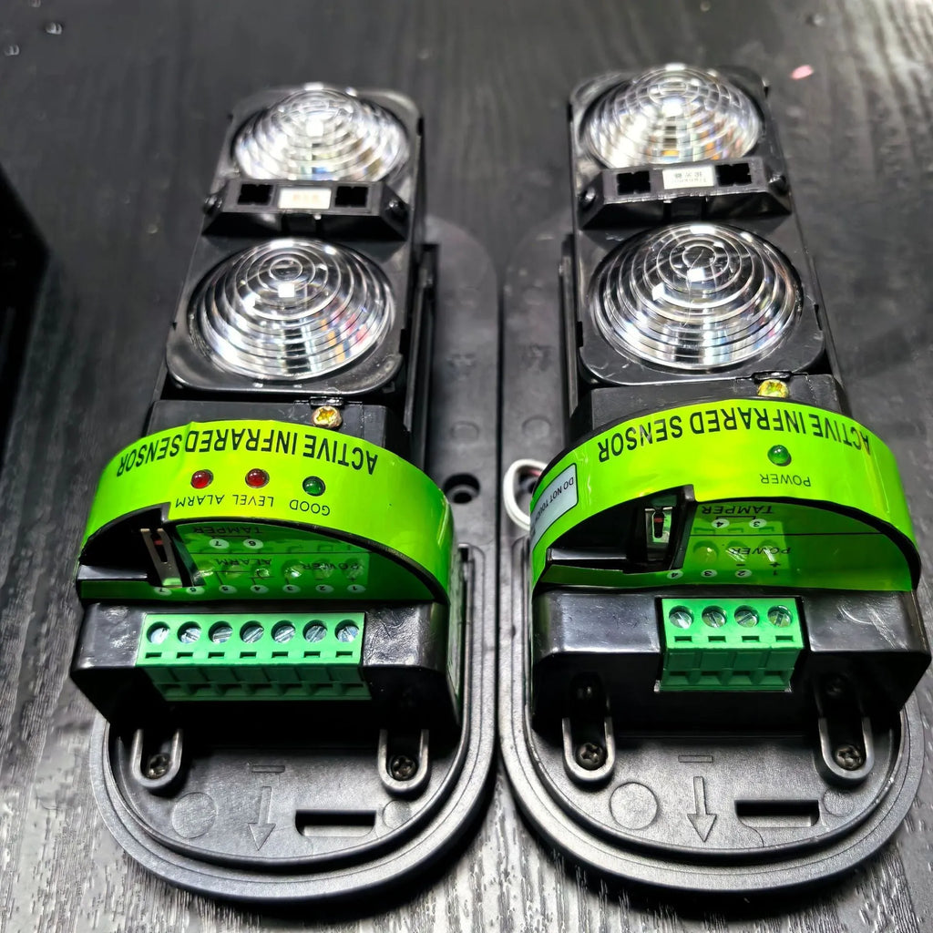 Black two-beam infrared security detector with wired connections for 150 metre perimeter protection