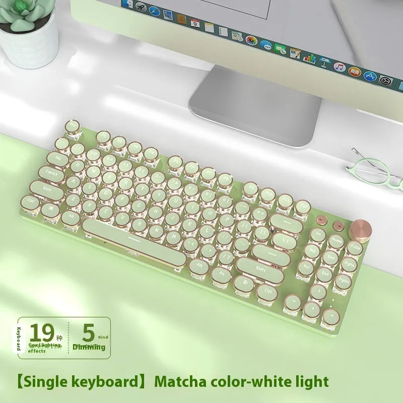 Matcha green mechanical gaming keyboard with multifunction knob on a desk
