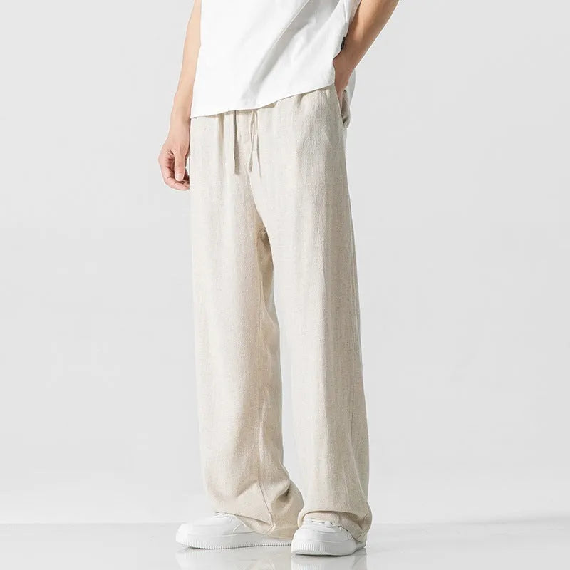 Men's cropped linen trousers in bamboo fibre with a loose straight-leg fit and drawstring waist.