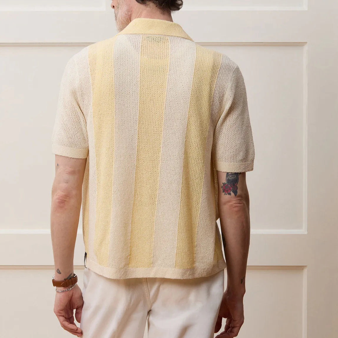 Yellow casual polo shirt with asymmetric hollow-out design and short sleeves