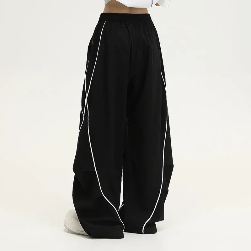Black pleated hip hop trousers with wide legs and striped pattern
