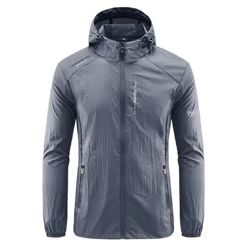 Man wearing a light grey loose-fitting hooded nylon summer jacket for sun protection.