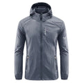 Man wearing a light grey loose-fitting hooded nylon summer jacket for sun protection.