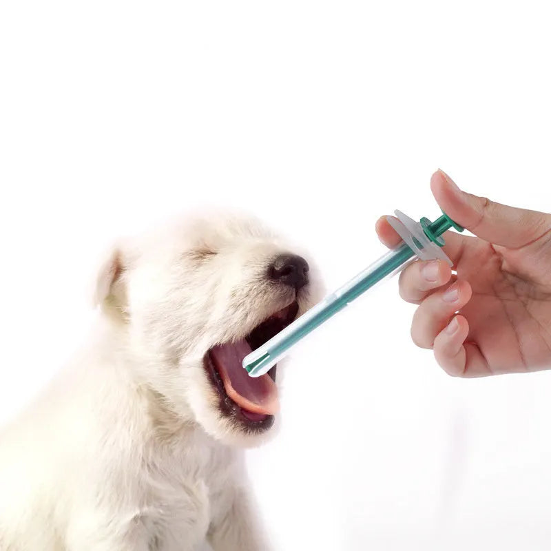 Two silica gel pet pill shooters for cats and dogs, showing soft tip and push rod.