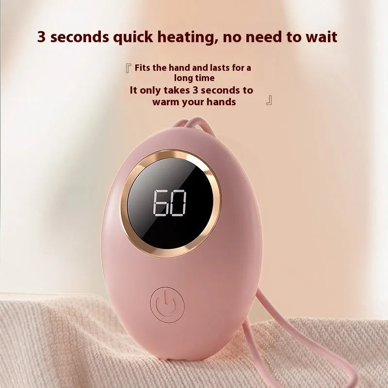 USB digital display hand warmer power bank in pink, showing aluminium heating plate