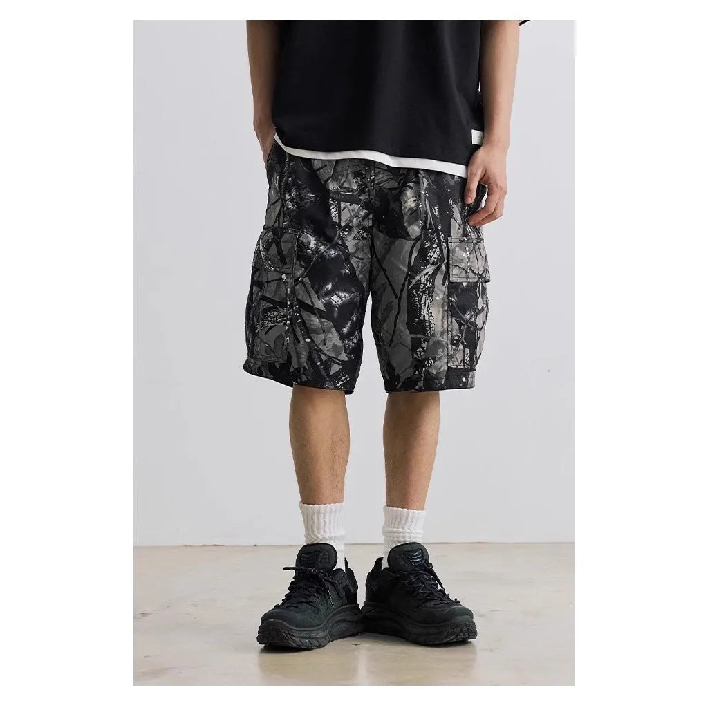 Men's loose fit straight-leg denim shorts in army green colour with a mid waist and zip fly.
