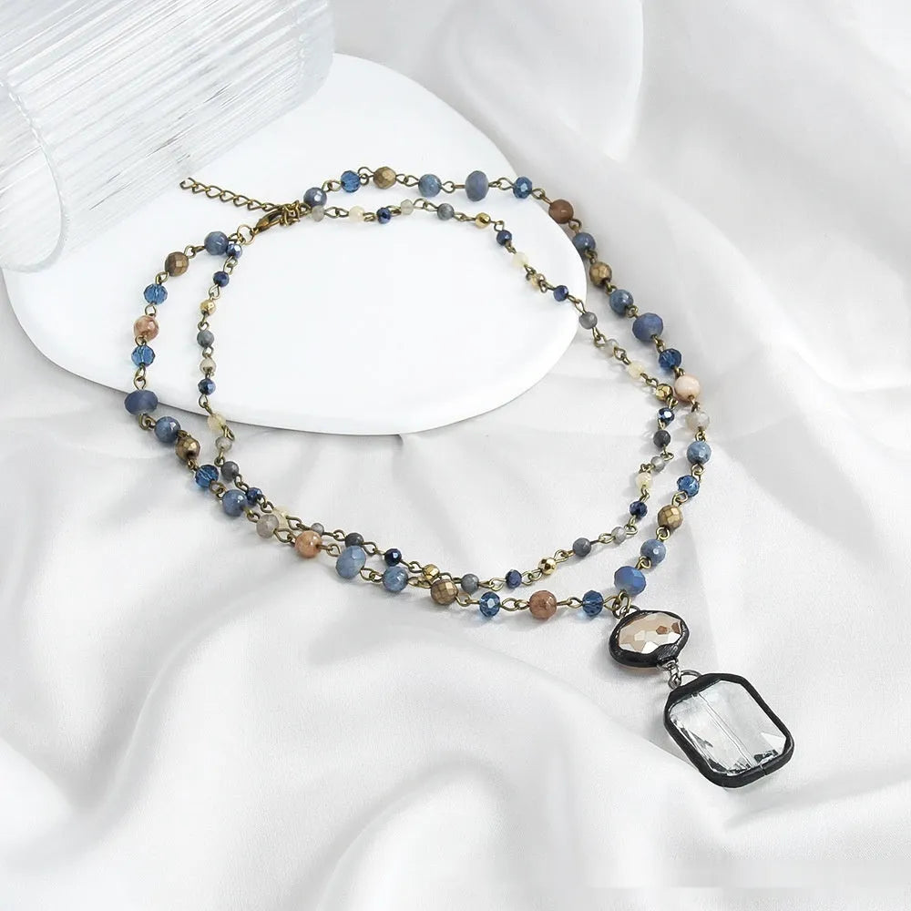 Tribal style two-layer necklace with natural stone and glass pendant on adjustable chain