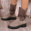 Women's black chunky heel snow boots with lace-up front and fleece lining