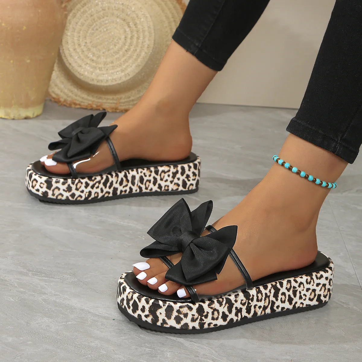 Women's leopard print beach slippers with thick soles and round toe in black colour