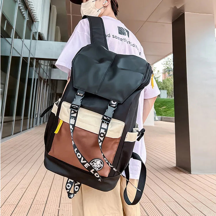 Oxford cloth backpack in black, green, or red, showing handheld and shoulder straps