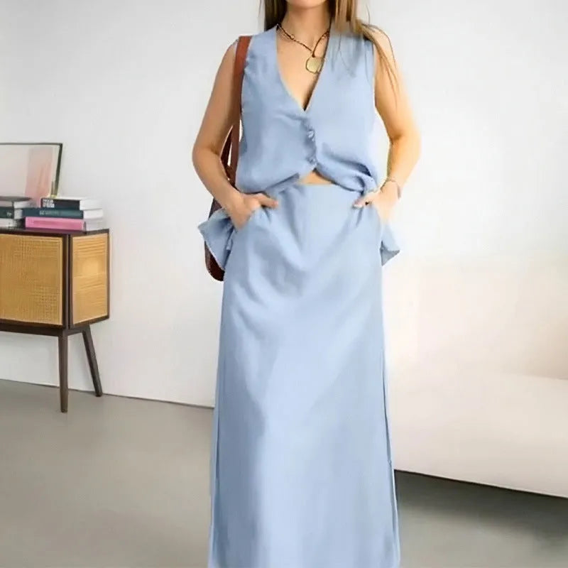 Women's blue casual two-piece set with sleeveless vest top and long skirt on hanger