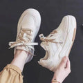 Women's low-top casual sneakers with height-increasing rubber soles in beige or pink colours