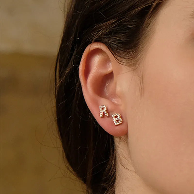 Brass gold plated alphabet letter earrings showing zircon detailing on copper base with 26 English letters available