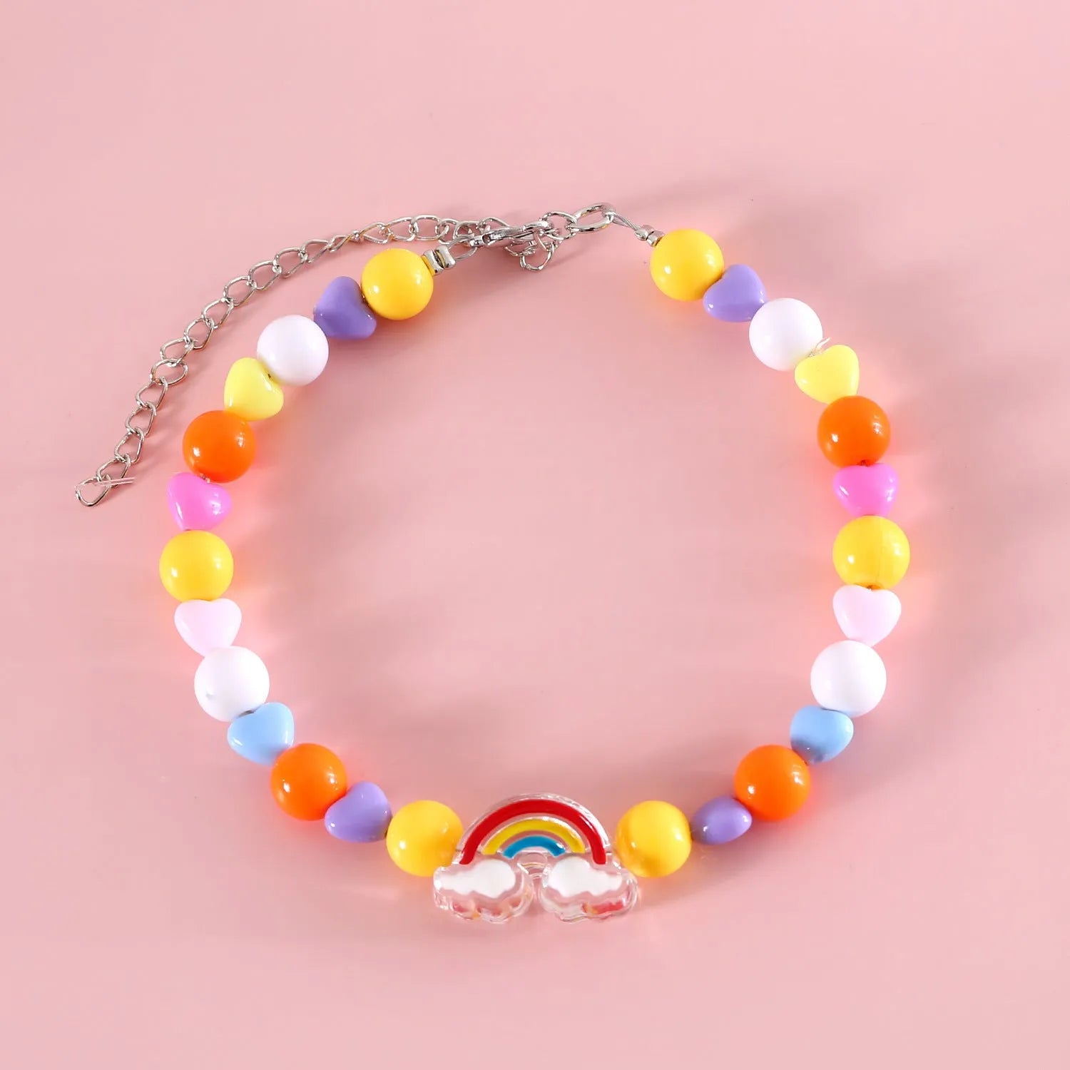 Colourful plastic bead cat necklace in rainbow, peach, or small flower pattern on a white background.