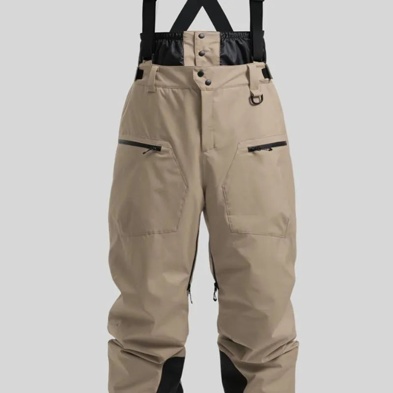 Men's black waterproof ski trousers with adjustable ankle straps on a model