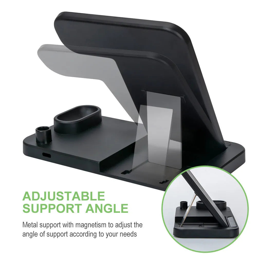 Black folding 4-in-1 wireless charger showing vertical stand mode charging an iPhone, with an Apple Pencil on its charging spot.