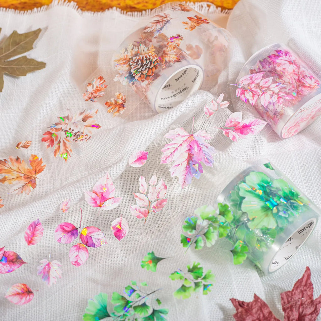 Roll of decorative leaf pattern stickers for hand account books showing six different natural designs including ginkgo and maple leaves