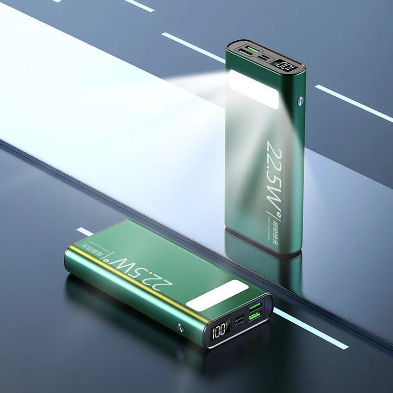 Black alloy power bank with LCD screen showing battery level, alongside green, red, and blue colour options.