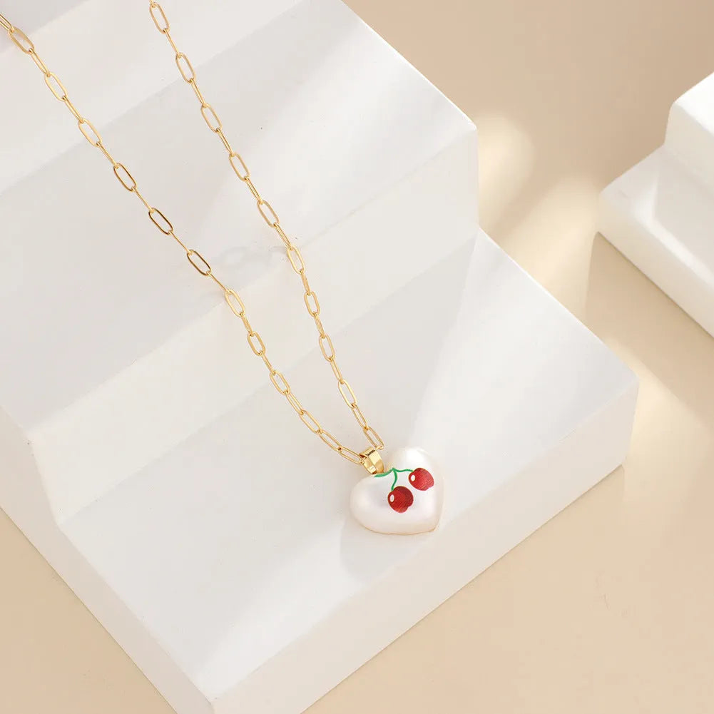 Fruit charm necklace with adjustable chain showing strawberry, pineapple, apple, pear and cherry pendant options