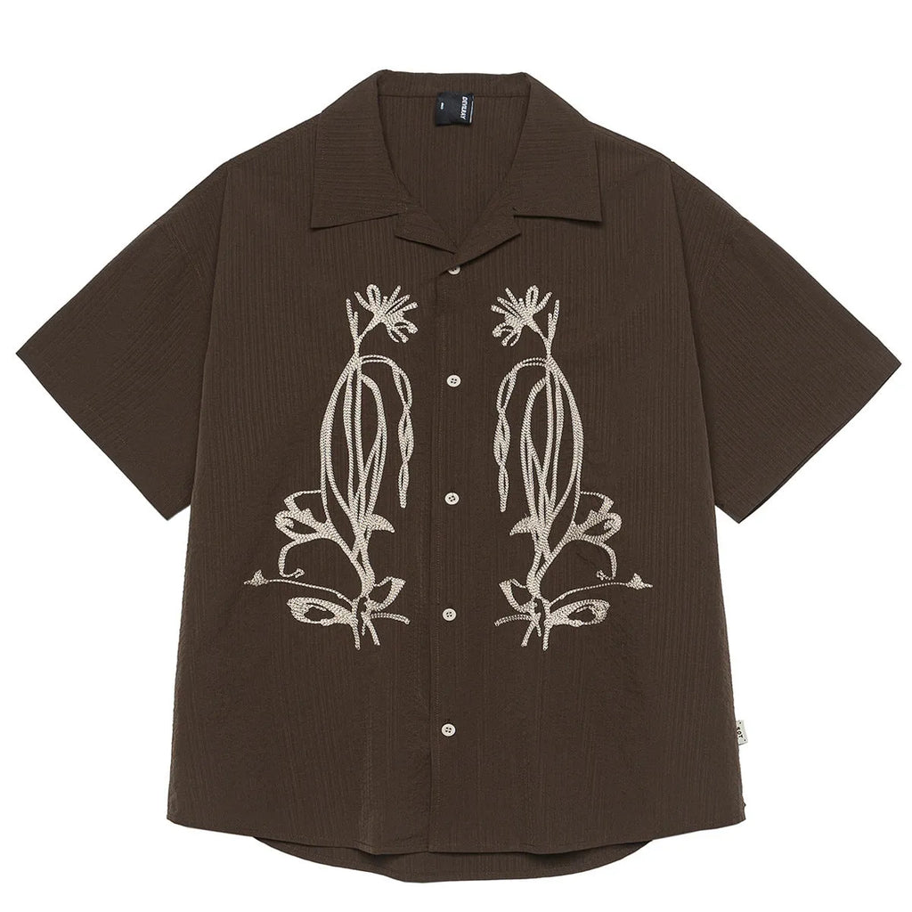 Brown striped Cuban collar short sleeve outdoor shirt laid flat.