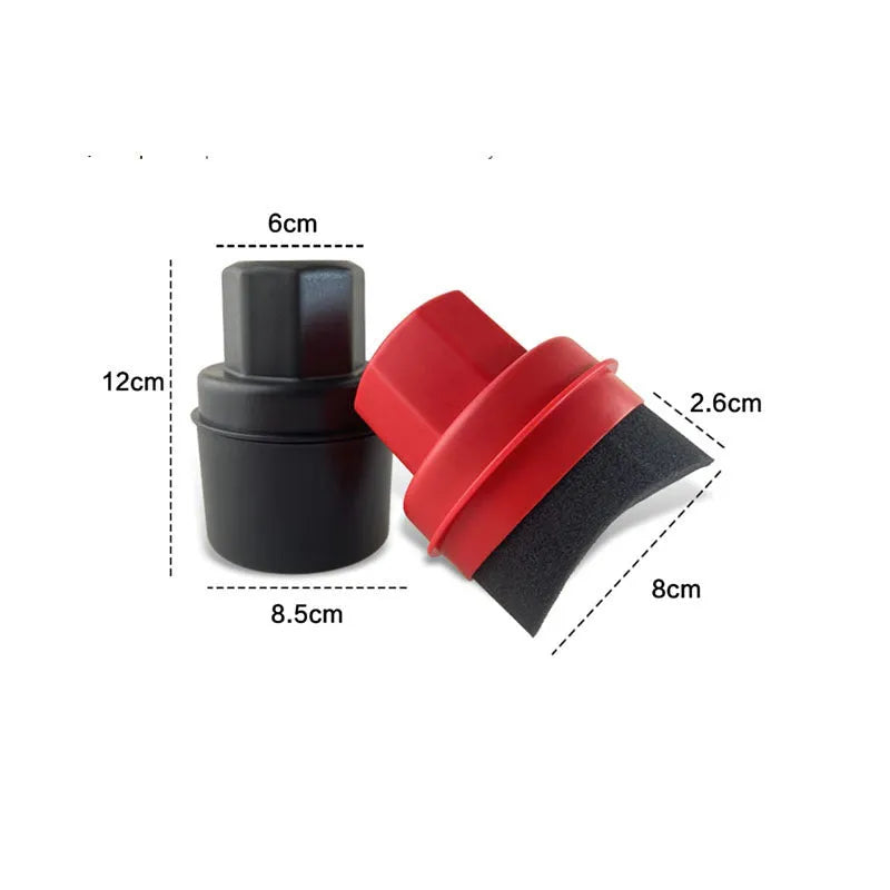 Black and red car tyre polishing sponge brushes with lids on a tyre sidewall