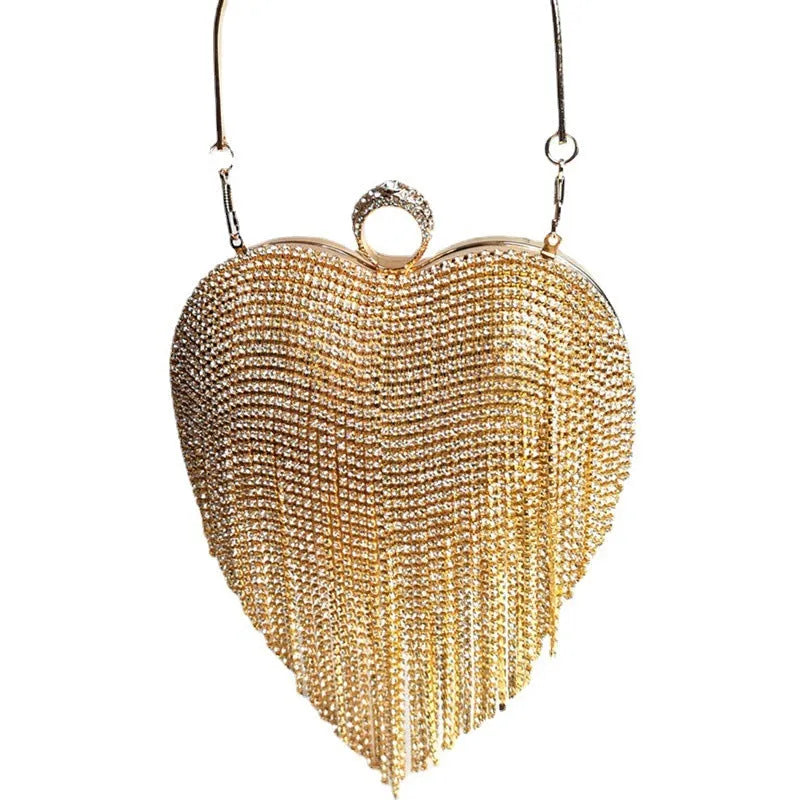 Women's heart-shaped metal dinner bag with tassel detail in black, gold, and silver options