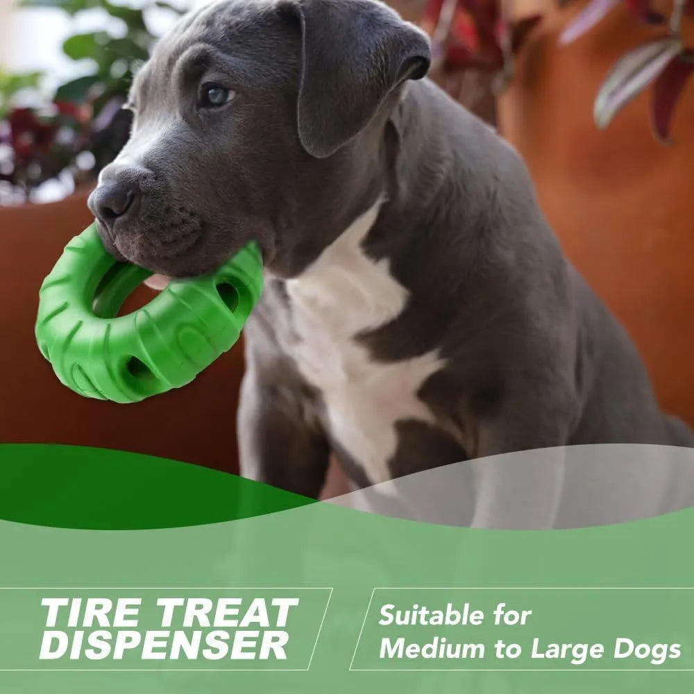 Blue natural rubber tyre-shaped dog chew toy with six oval openings, shown next to a red and green version.