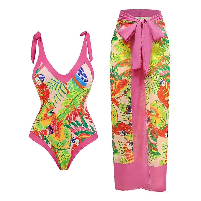 Pink floral print women's V-neck one-piece swimsuit with an attached skirt cover