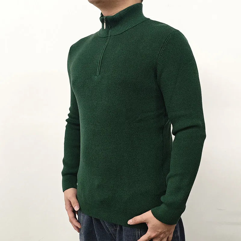 Man wearing a grey half turtleneck zipper sweater, a British style cotton blend pullover for spring.