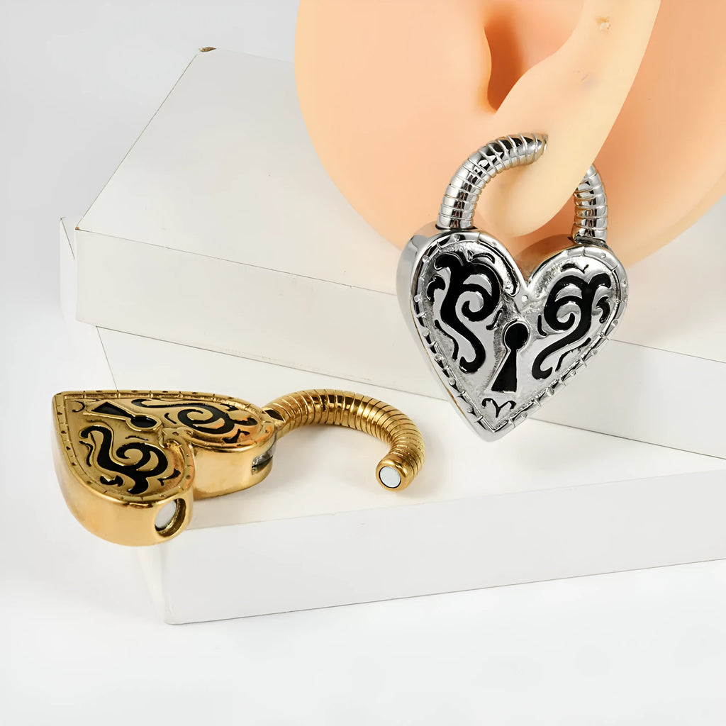 Close-up of a women's stainless steel heart-shaped earring with a gold electroplated finish.