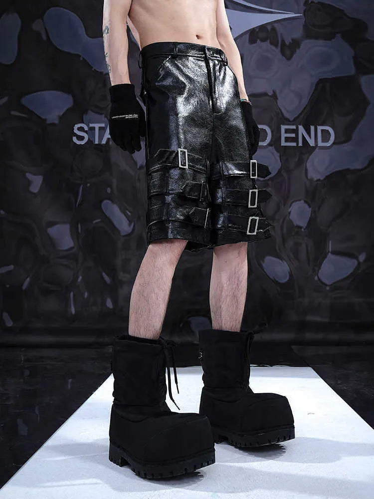 Men's black casual shorts with leather ring detail on PU leather panels