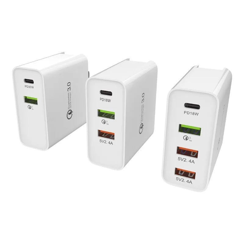 White multi-port fast charger with PD and QC support showing UK plug configuration