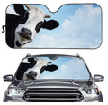 Telescopic aluminium foil car sun visor extended across a vehicle windshield