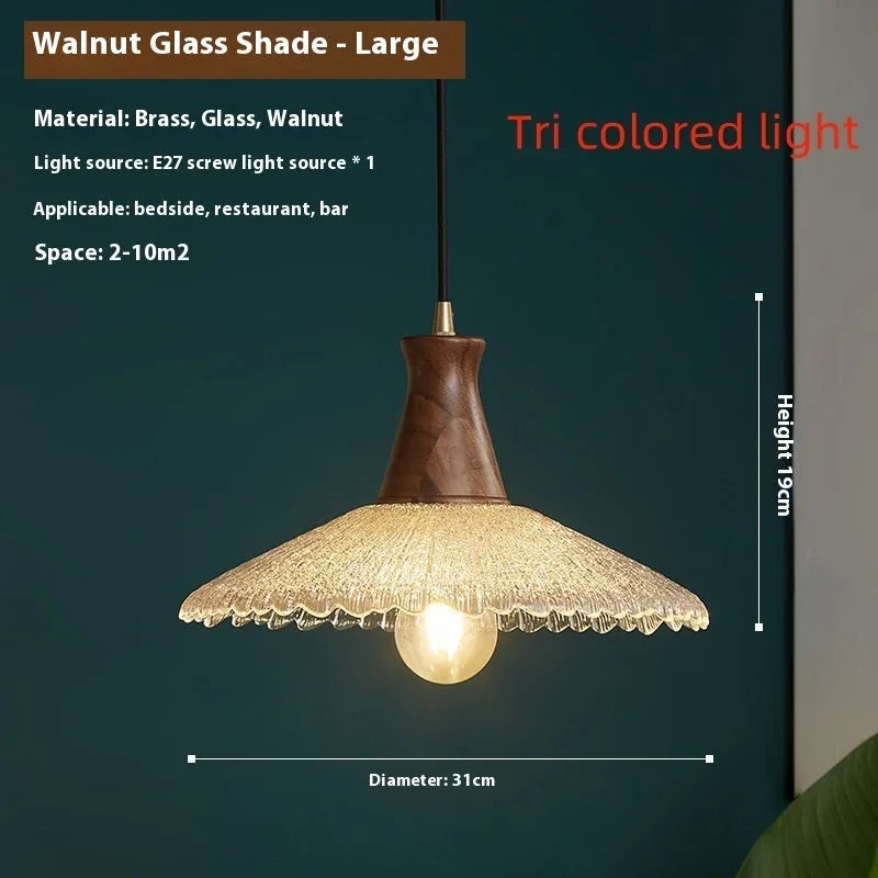 Wood and brass ceiling chandelier with glass lampshade in three available sizes.