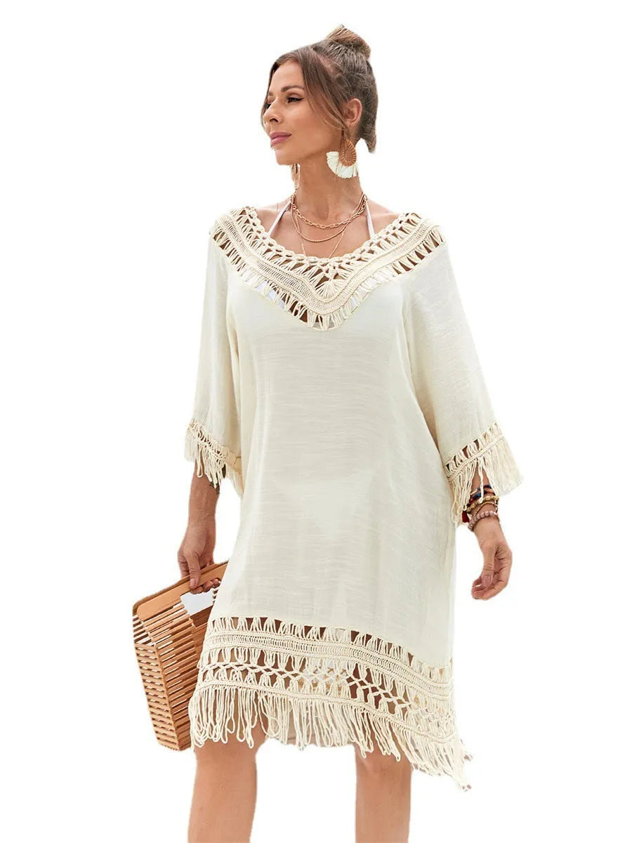 Apricot hand-crocheted long beach dress for women on a beach
