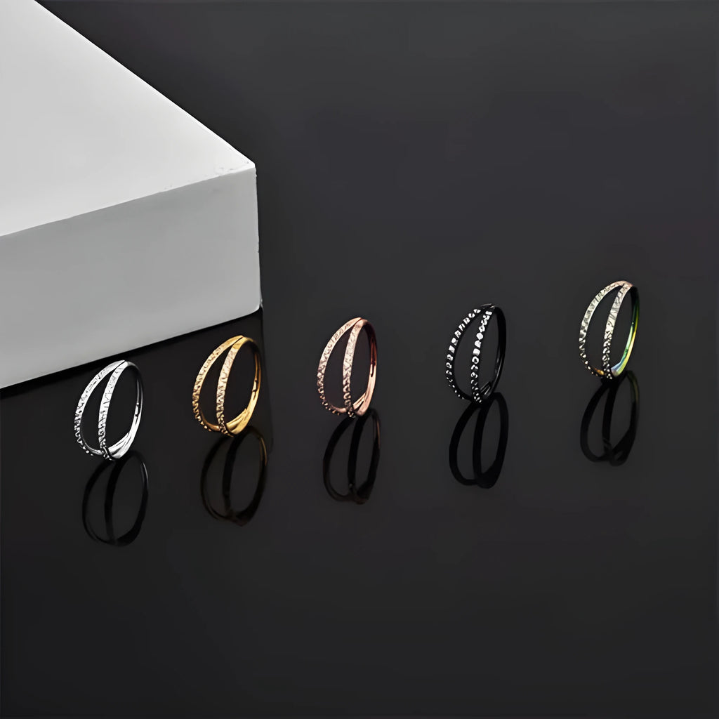 G23 titanium alloy lip ring nose ring with diamond treatment in steel or gold colour, showing puncture ring design