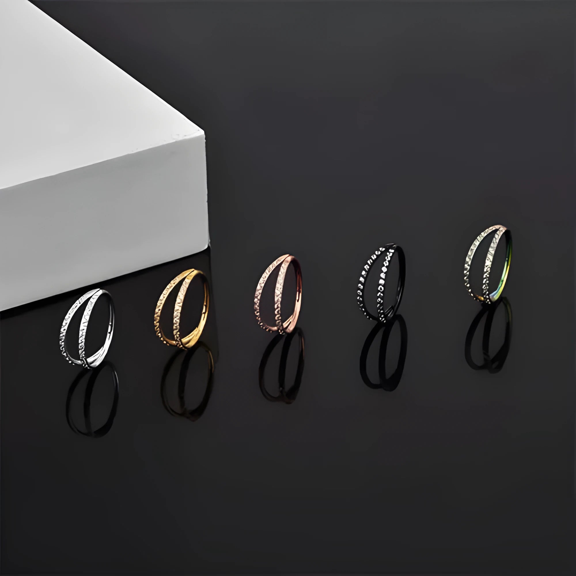 G23 titanium alloy lip ring nose ring with diamond treatment in steel or gold colour, showing puncture ring design