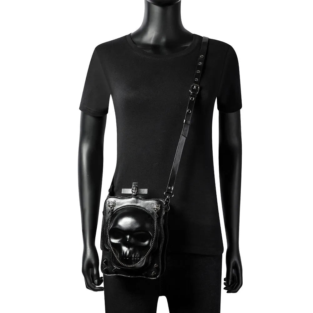 Black Gothic mini square messenger bag with embossed skull design, metal rivets, and a chain strap.