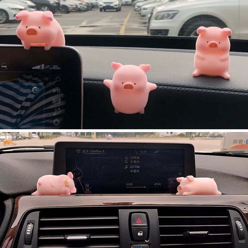 Cute cartoon pig resin ornament for car dashboard decoration on a neutral background.