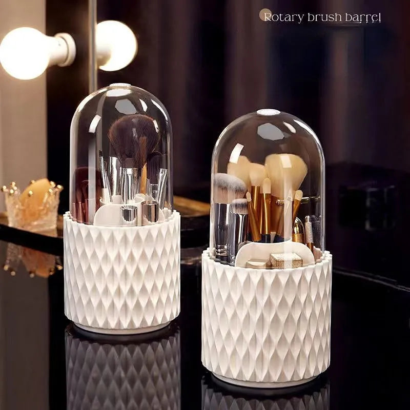 White rotating transparent makeup brush storage tube with dust cover lid on desktop