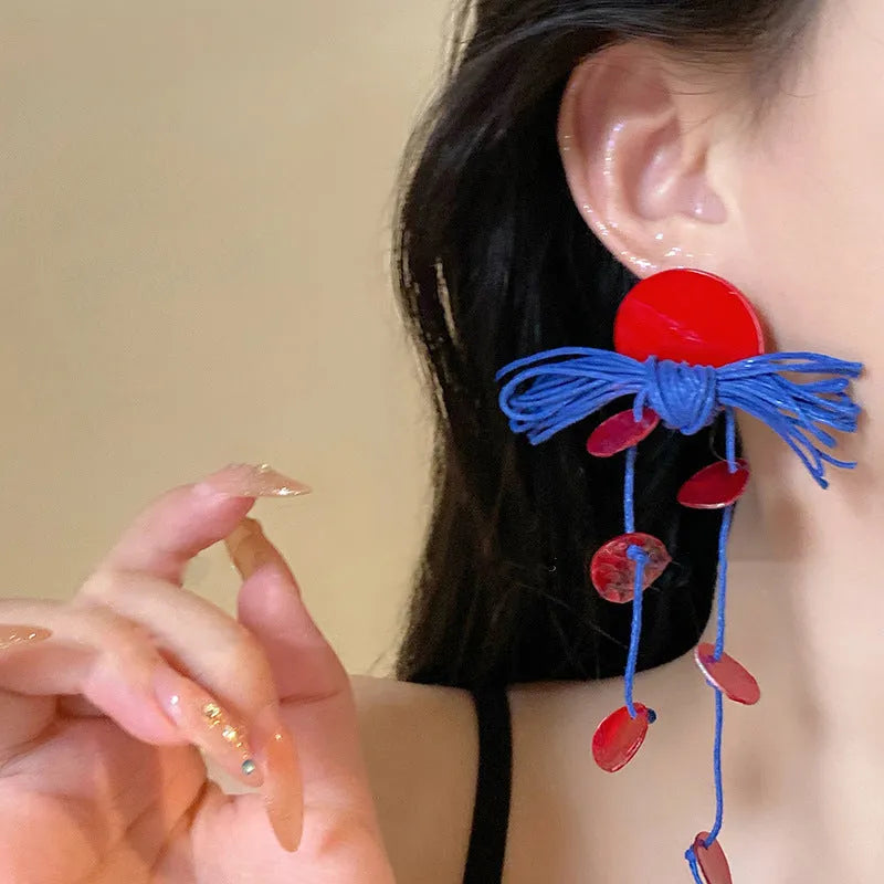Handmade geometric blue resin flower cloth earrings for women on a silver needle base.