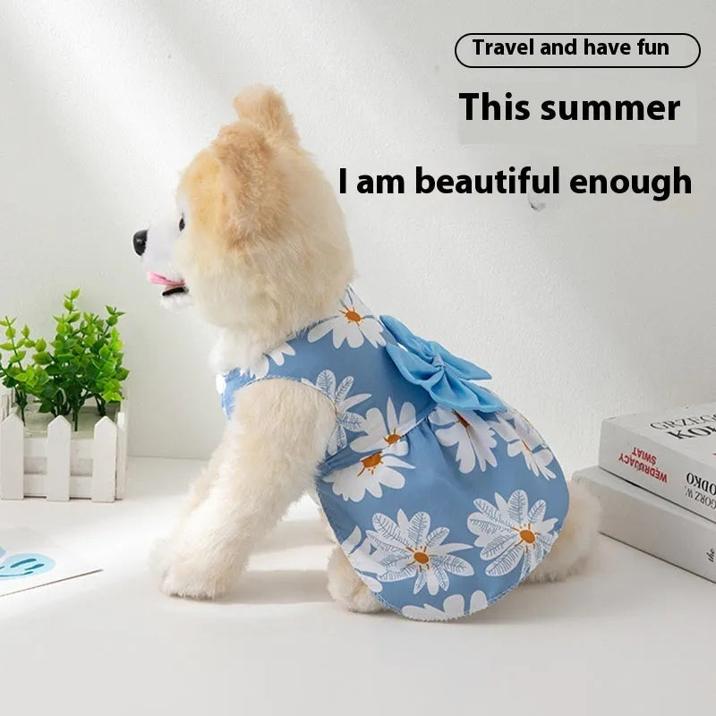 Orange floral butterfly pet dress with a bow on a dog, showing thin summer clothing.