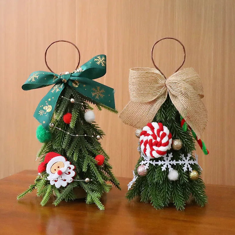 Mini Christmas tree ornament in red and white snowflake design on a tree branch
